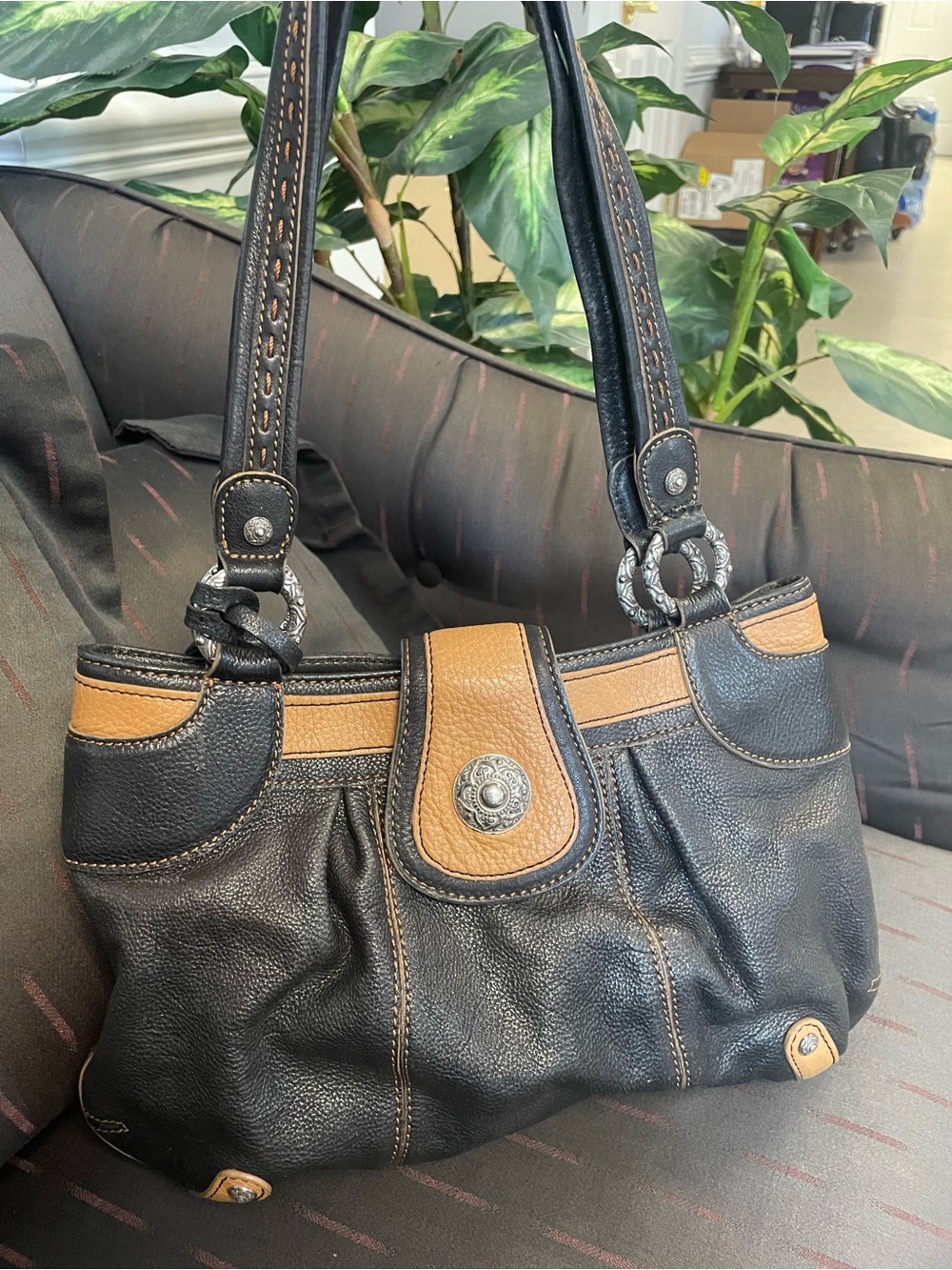 Brighton Black and Tan Leather Shoulder Bag with Concho Accent
